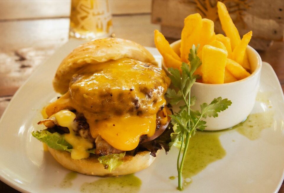 the orchards farmstall shows you how to cook the perfect burger on a plate with fries