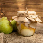 taste grabouw with this illustration of a pear and pear compote with rustic background