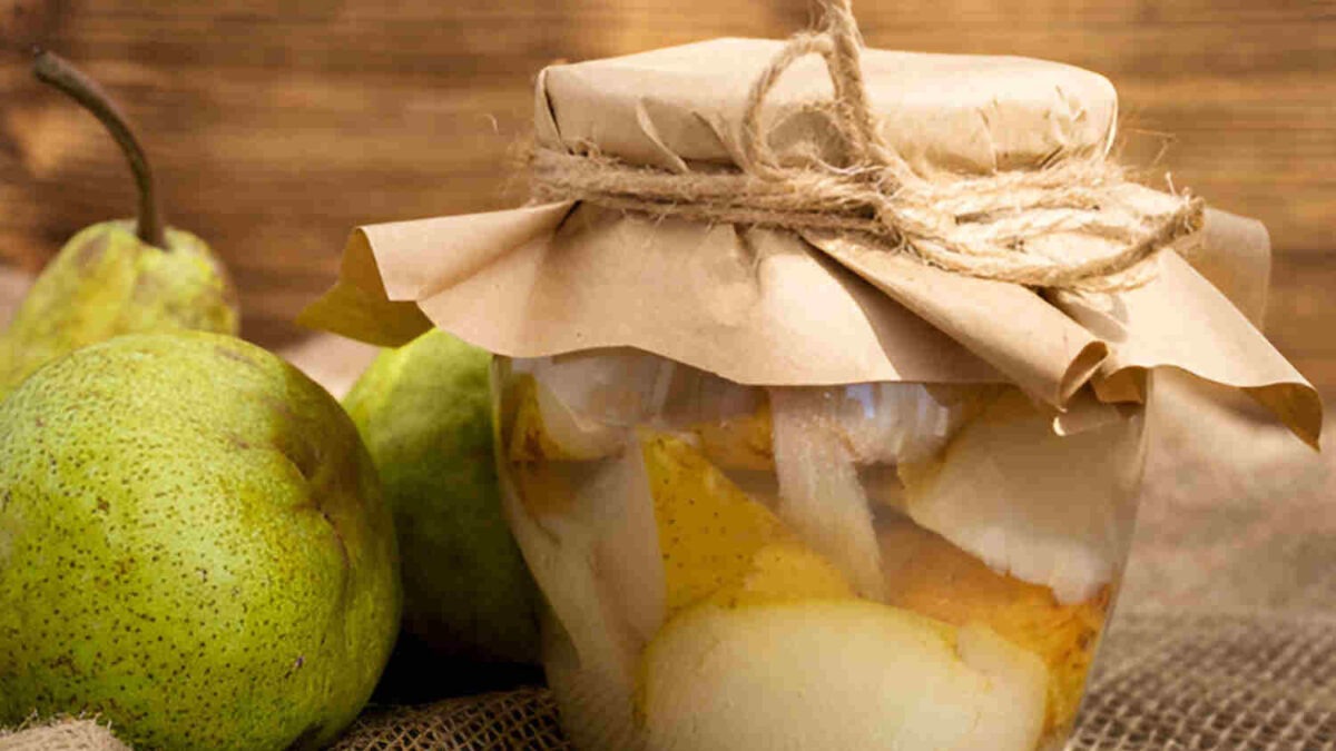 taste grabouw with this illustration of a pear and pear compote with rustic background