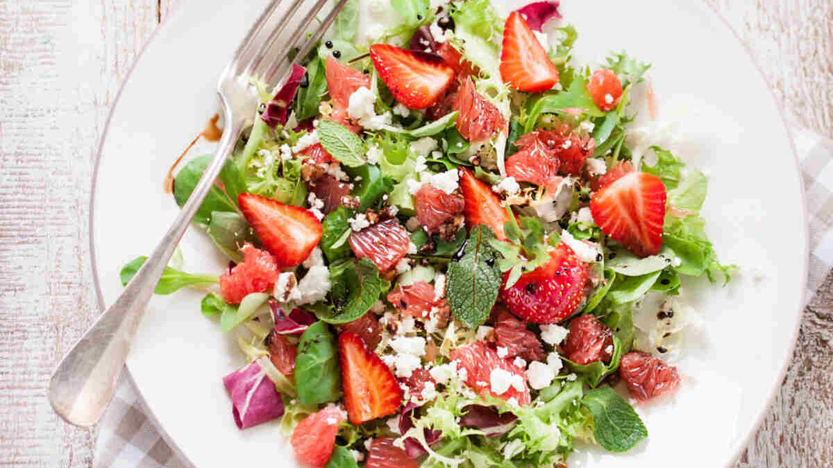 Rustic Spring Salads illustrated by a Spinach, Strawberry, and Feta Salad