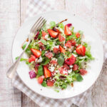 Rustic Spring Salads illustrated by a Spinach, Strawberry, and Feta Salad