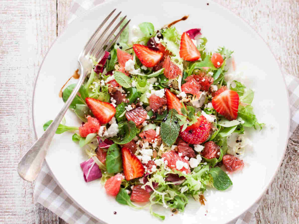 Rustic Spring Salads illustrated by a Spinach, Strawberry, and Feta Salad