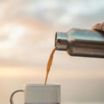 Published by Divine SEO on November 6, 2025 Categories Tags Why Your Stainless Steel Thermos Changes the Taste of Your Coffee illustrated by coffee being poured in a cup from steel thermos