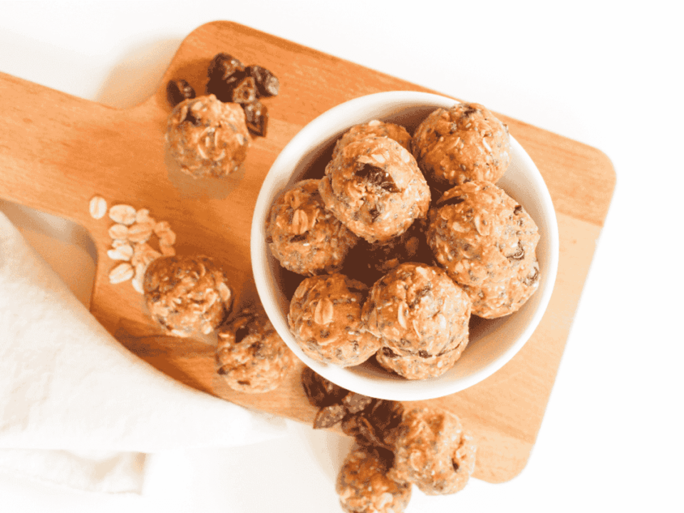 Oat balls on a white backdrop, healthy snacks