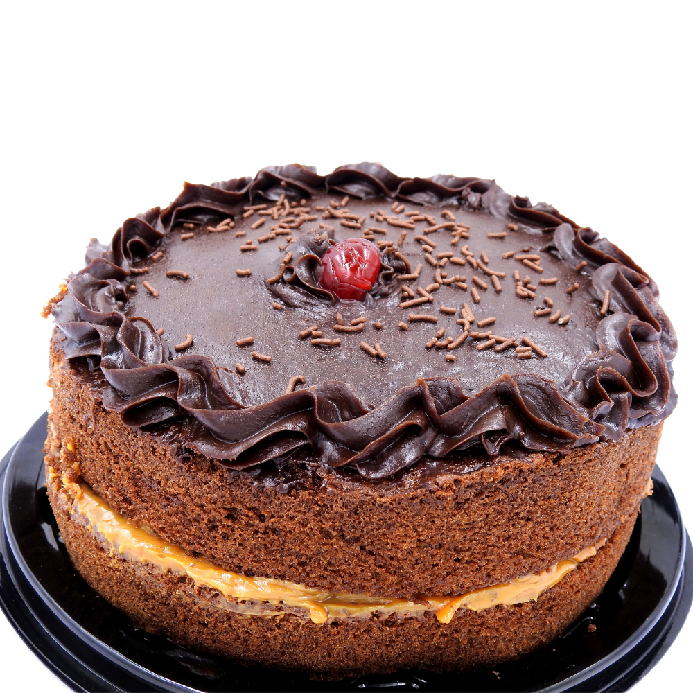 A detailed view of a moist chocolate cake made with high-quality cocoa, capturing its tender texture and intense chocolate flavour in a classic presentation.