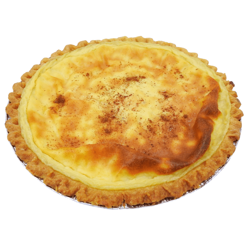 traditional South African milk tart with a smooth, creamy custard filling set in a delicate buttery crust, lightly dusted with cinnamon, showcasing its classic homemade look and comforting dessert appeal.
