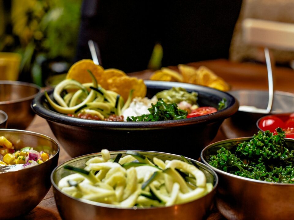 A variety of easy side dishes that steal the show at any meal, including roasted potatoes, fresh salad, and sautéed vegetables on a shared table.