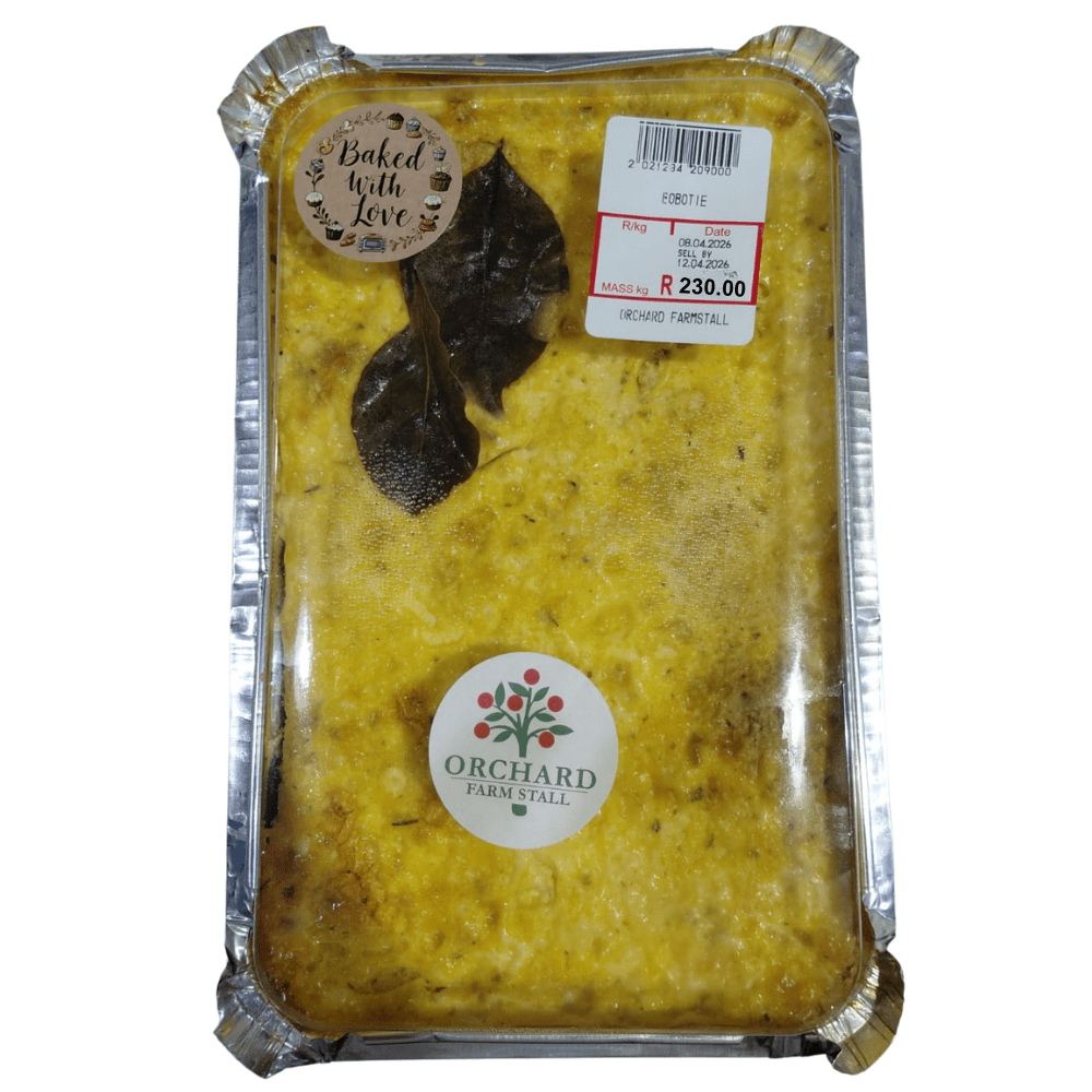 traditional bobotie made with gently spiced minced meat and a savoury baked egg custard topping, served with yellow rice, tomato relish, and coconut banana, presented as a hearty dish with a cover packaging