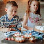 Kids baking simple desserts in a farm kitchen with fresh ingredients