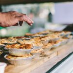 Best Farm Stall Stop showcasing baked pies on wooden counter