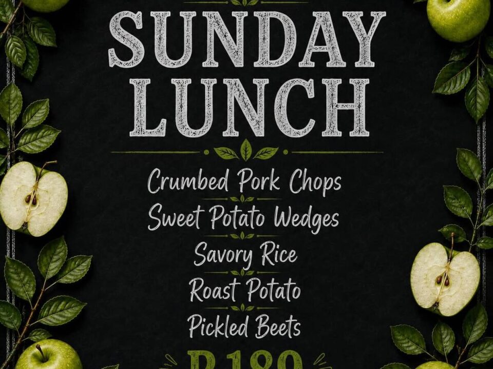 Family enjoying Sunday lunch at The Orchard Farm Stall with homemade food, fresh baking, outdoor seating, and a children's play area.
