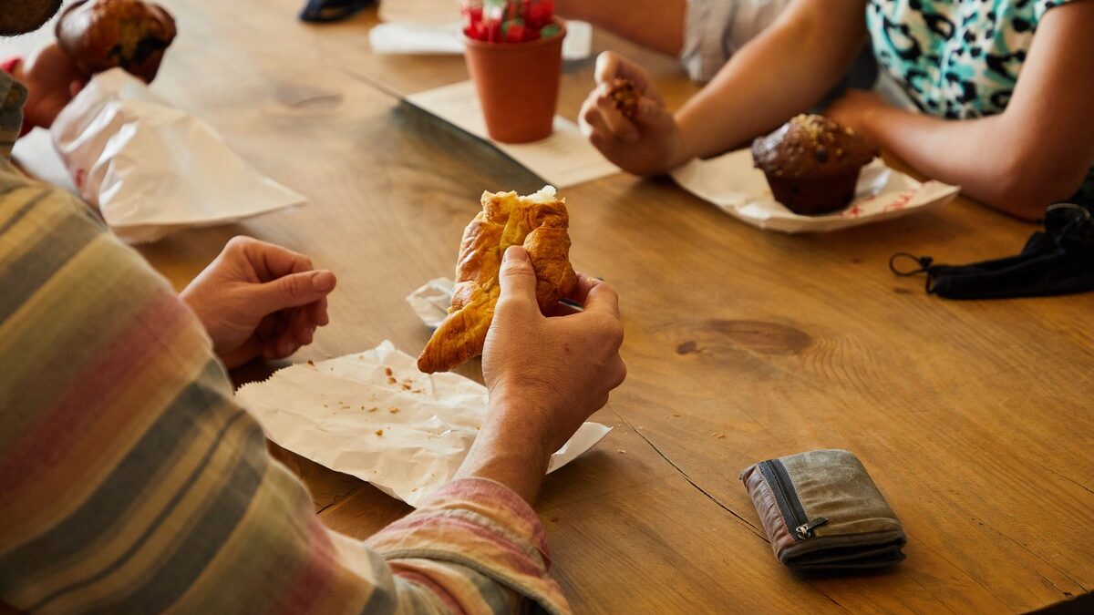 Family enjoying homemade lunch and fresh baking at The Orchard Farm Stall in the Elgin Valley.
