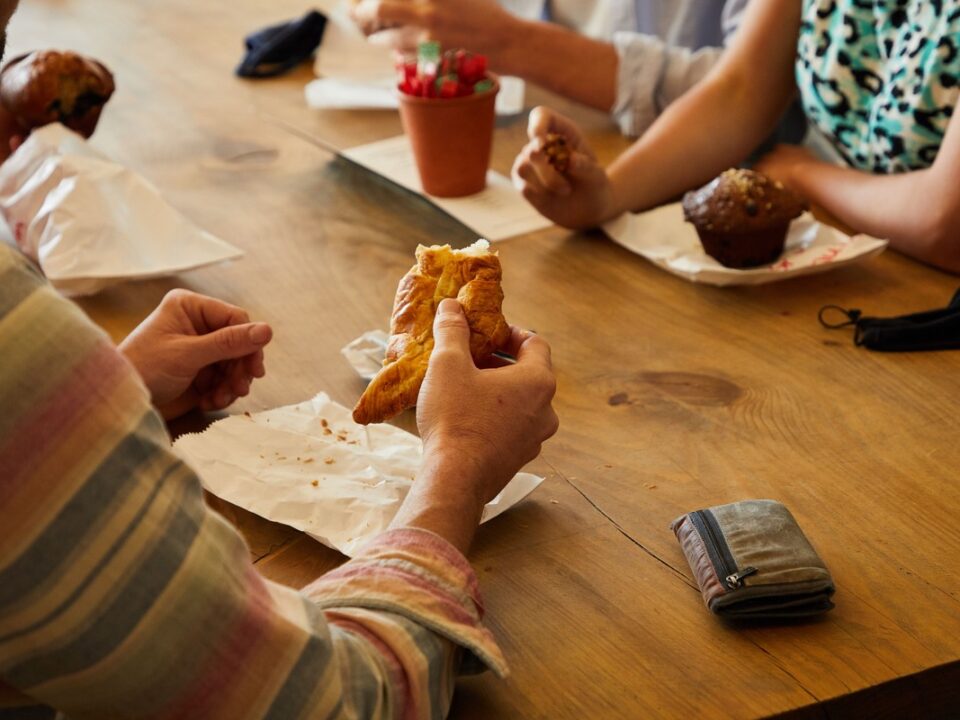 Family enjoying homemade lunch and fresh baking at The Orchard Farm Stall in the Elgin Valley.