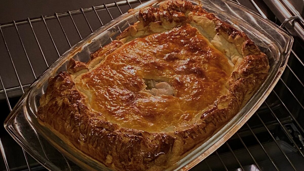 a golden pie baking in the over to illustrate good homemade pies