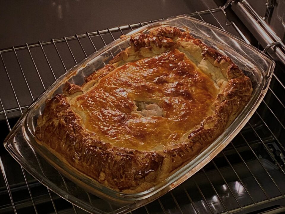 a golden pie baking in the over to illustrate good homemade pies